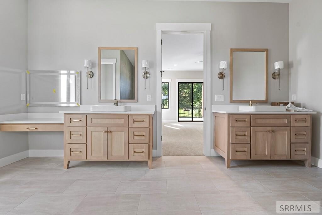Dual vanities in white oak with brushed gold hardware